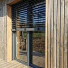 Baies vitrées hybrides en bois aluminium